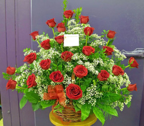 Wicker Basket of Two Dozen Red Roses from Clark Flower and Gift Shop in Clark, SD