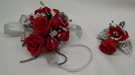 Red Spray Roses with Silver Accents Wrist Corsage from Clark Flower and Gift Shop in Clark, SD