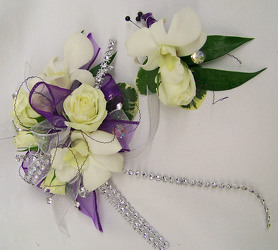 White Wrist Corsage with Purple & Silver Accents from Clark Flower and Gift Shop in Clark, SD